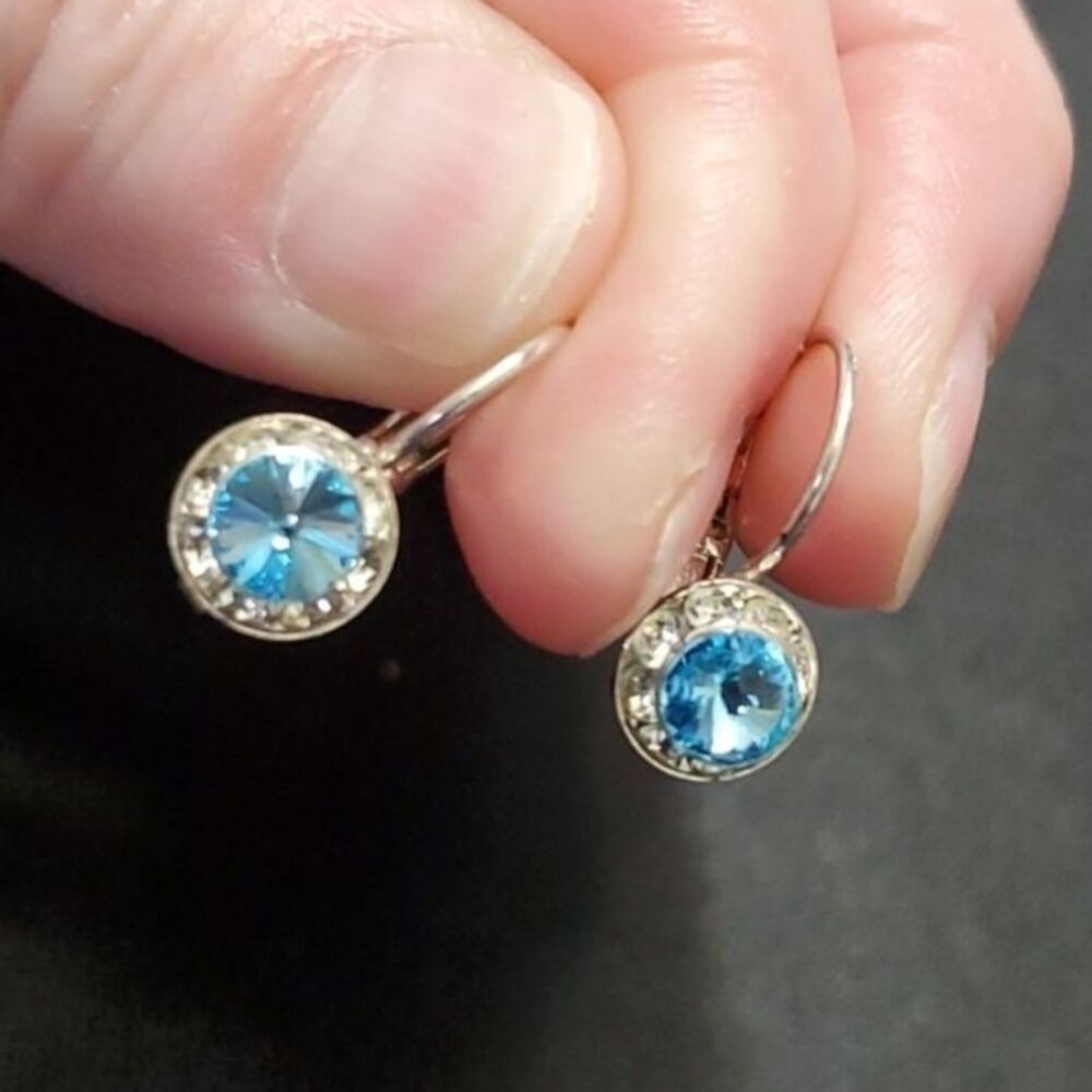 Silver tone dangling blue rhinestone earrings
